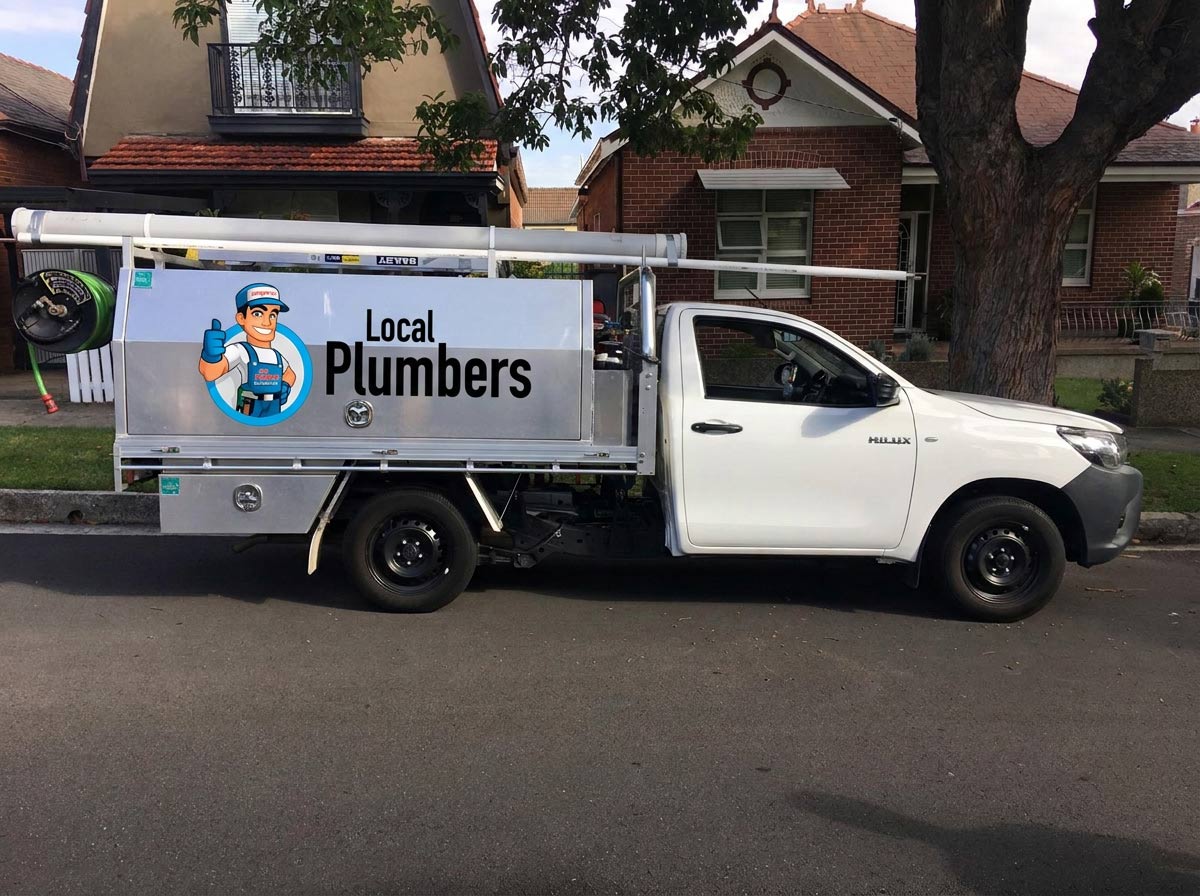 Plumber inspecting a pipe in Northern Beaches